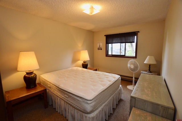 carpeted bedroom featuring a textured ceiling