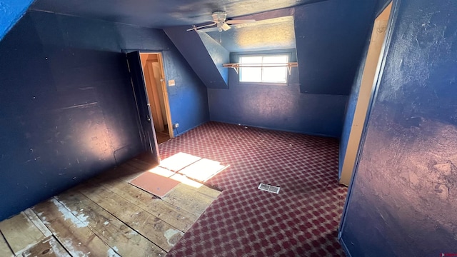 bonus room featuring ceiling fan, wood-type flooring, and lofted ceiling