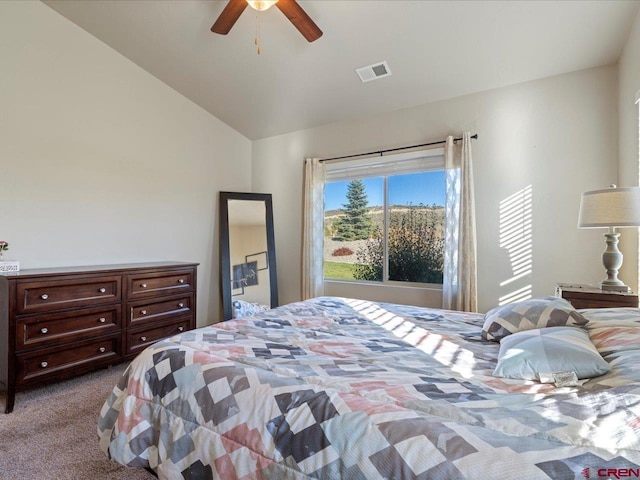 bedroom with carpet flooring, ceiling fan, and lofted ceiling