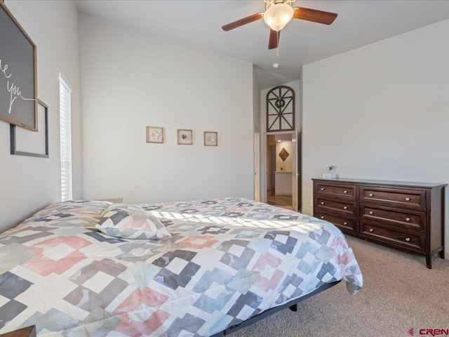 carpeted bedroom featuring ceiling fan