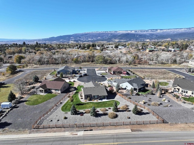 birds eye view of property with a mountain view