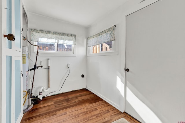 laundry room with dark hardwood / wood-style flooring