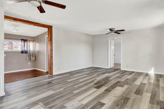 unfurnished room featuring ceiling fan and light hardwood / wood-style flooring