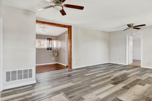 unfurnished room featuring ceiling fan and light hardwood / wood-style floors