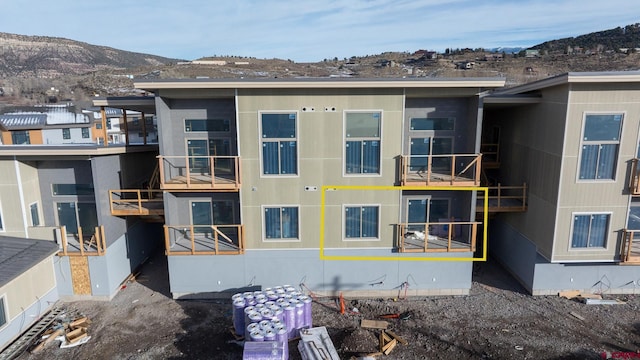 back of house featuring a mountain view