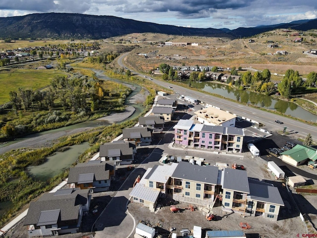 bird's eye view featuring a water and mountain view