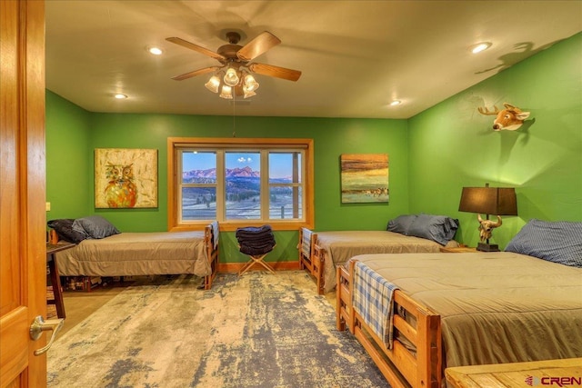 carpeted bedroom featuring ceiling fan