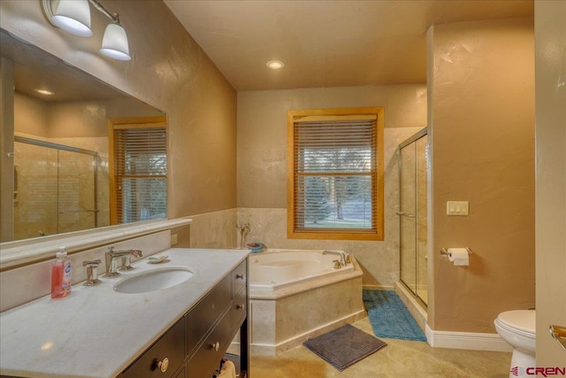 full bathroom featuring vanity, separate shower and tub, and toilet