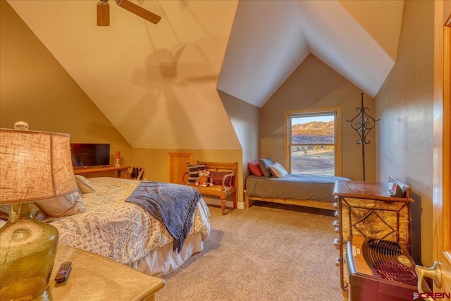 bedroom featuring ceiling fan, carpet floors, and vaulted ceiling