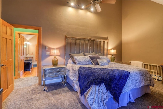 bedroom with carpet, ceiling fan, and lofted ceiling