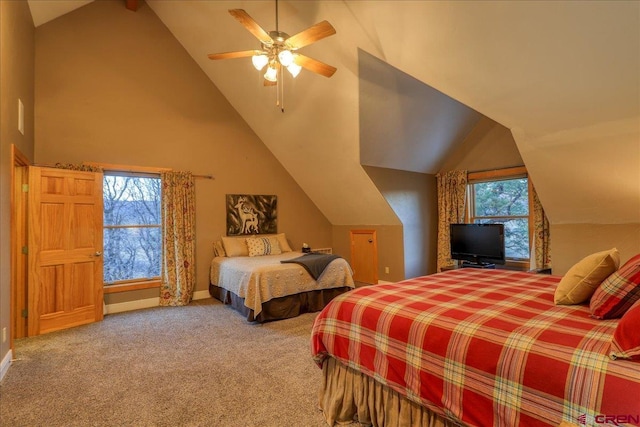 carpeted bedroom with ceiling fan, lofted ceiling, and multiple windows