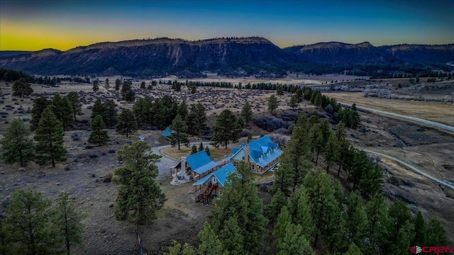 aerial view at dusk with a mountain view