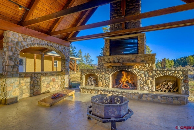 view of patio with an outdoor stone fireplace