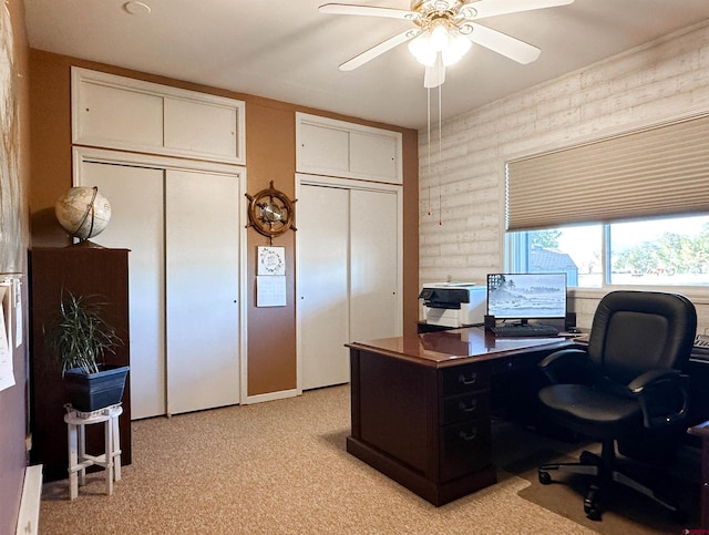 office area with ceiling fan and light carpet