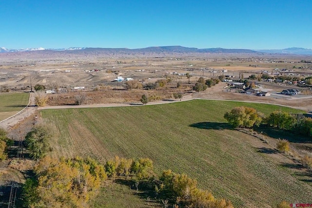 drone / aerial view featuring a mountain view and a rural view