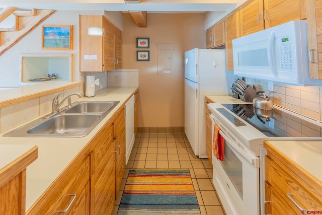 kitchen with decorative backsplash, sink, light tile patterned flooring, and white appliances