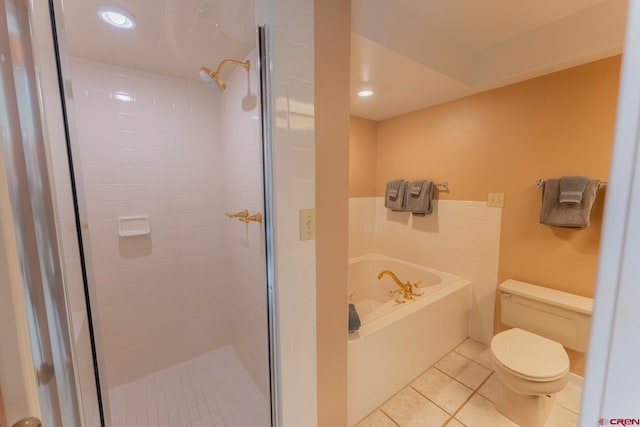 bathroom with tile patterned flooring, separate shower and tub, and toilet