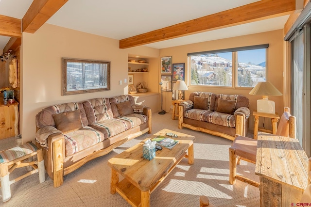 carpeted living room with beam ceiling