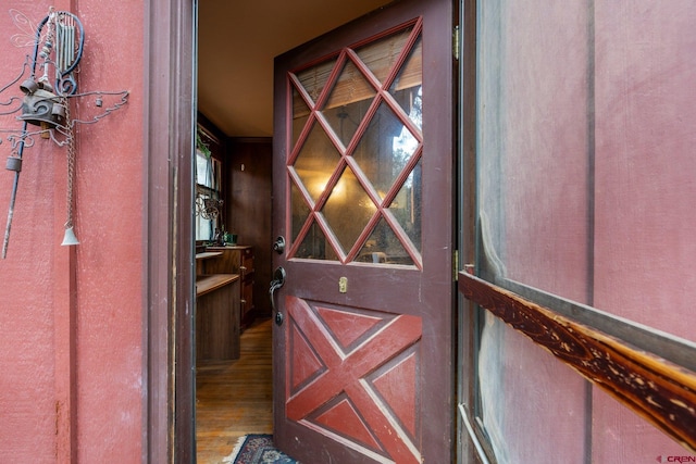 wine cellar with hardwood / wood-style flooring