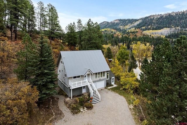 birds eye view of property with a mountain view