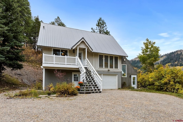 view of front of home featuring a mountain view and a garage