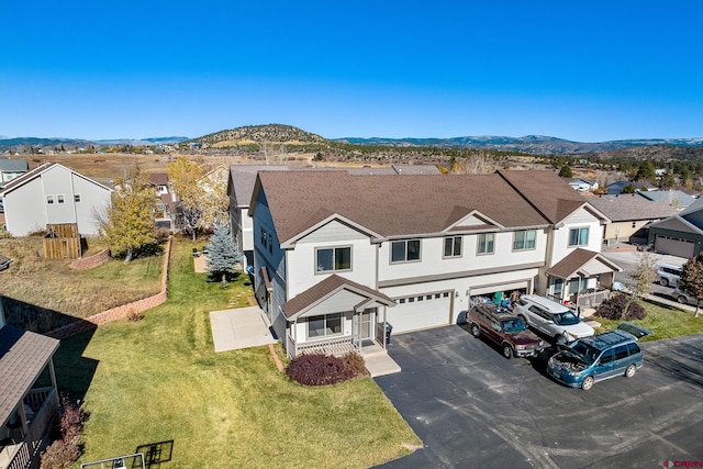 birds eye view of property with a mountain view