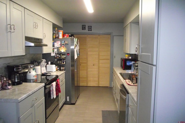 kitchen featuring white cabinetry, sink, and appliances with stainless steel finishes