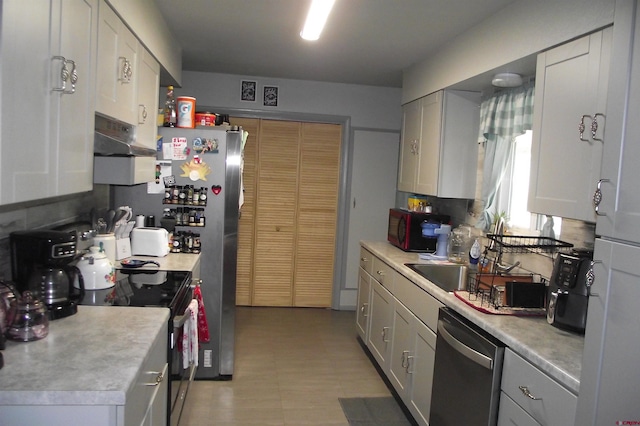 kitchen featuring dishwasher, electric range, and white cabinetry