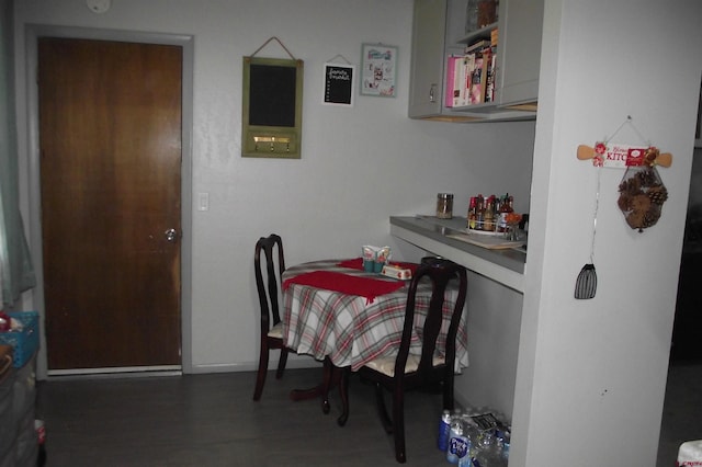 dining room with dark wood-type flooring