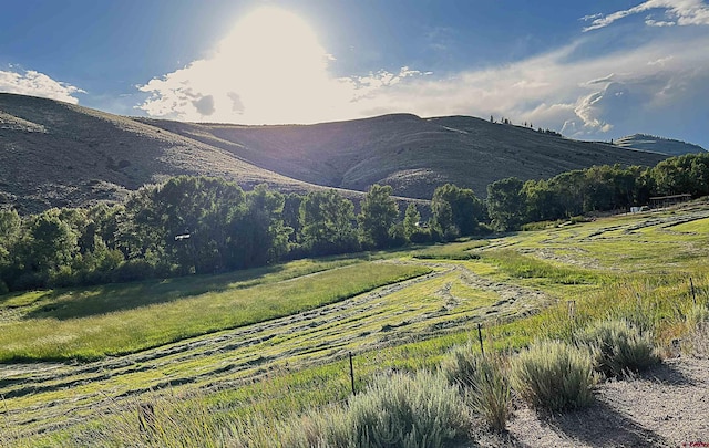 mountain view featuring a rural view