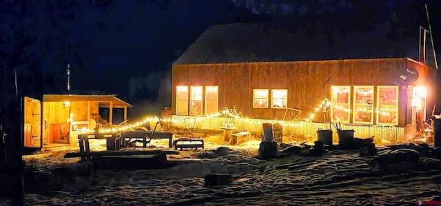 view of back house at night