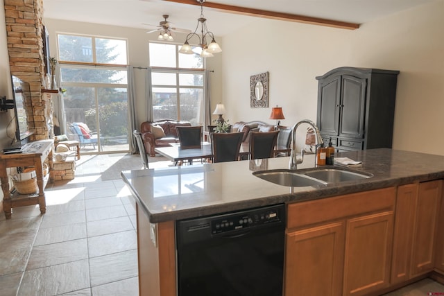 kitchen with ceiling fan with notable chandelier, dishwasher, a wealth of natural light, and sink