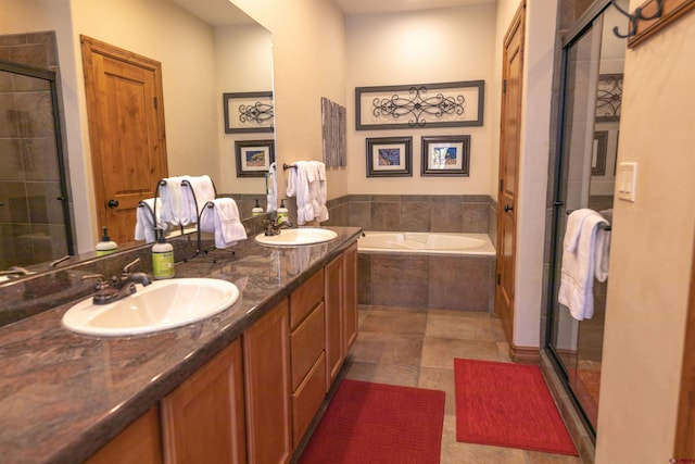 bathroom with plus walk in shower, tile patterned floors, and vanity