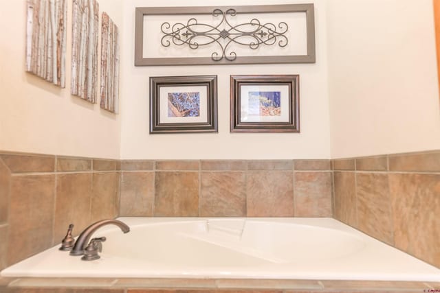 bathroom with tiled tub