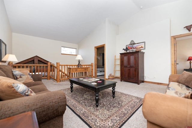 living room with lofted ceiling and light carpet