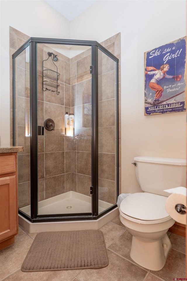 bathroom with walk in shower, vanity, and toilet