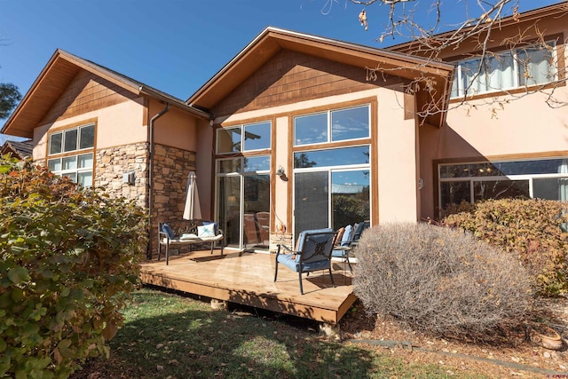 rear view of house with a wooden deck