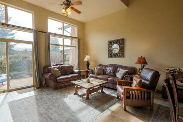 tiled living room featuring ceiling fan