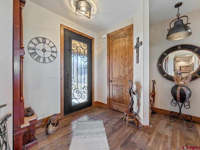 foyer with dark hardwood / wood-style floors