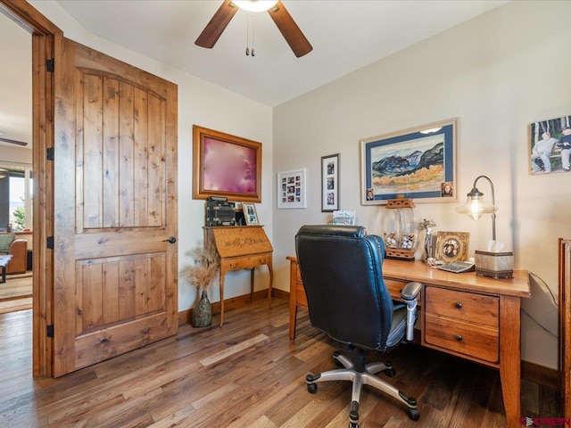 office area with light wood-type flooring and ceiling fan