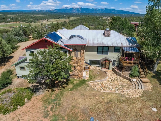 exterior space featuring a deck with mountain view