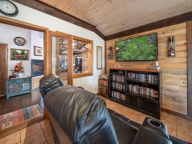 living room with light tile patterned floors and wooden ceiling