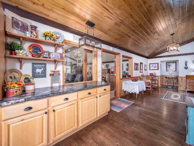 kitchen featuring dark hardwood / wood-style floors, light brown cabinetry, pendant lighting, and lofted ceiling