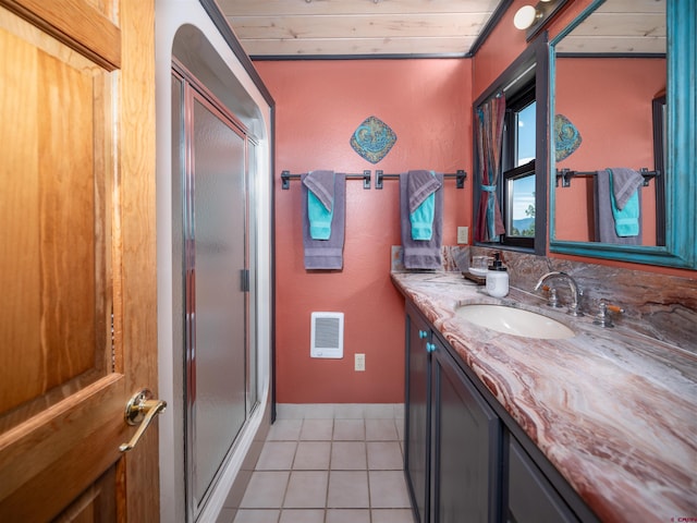 bathroom with tile patterned flooring, a shower with shower door, wooden ceiling, and vanity