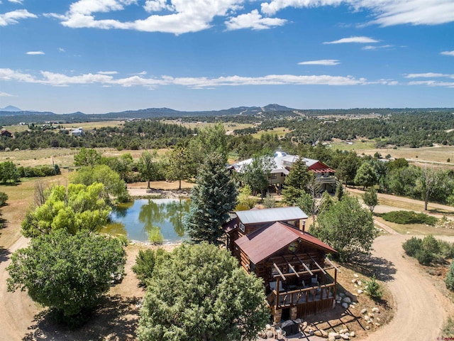 aerial view featuring a water and mountain view