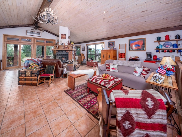 living room with ceiling fan with notable chandelier, vaulted ceiling with beams, tile patterned floors, and wooden ceiling