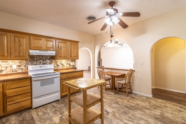 kitchen with electric range, ceiling fan, and decorative backsplash