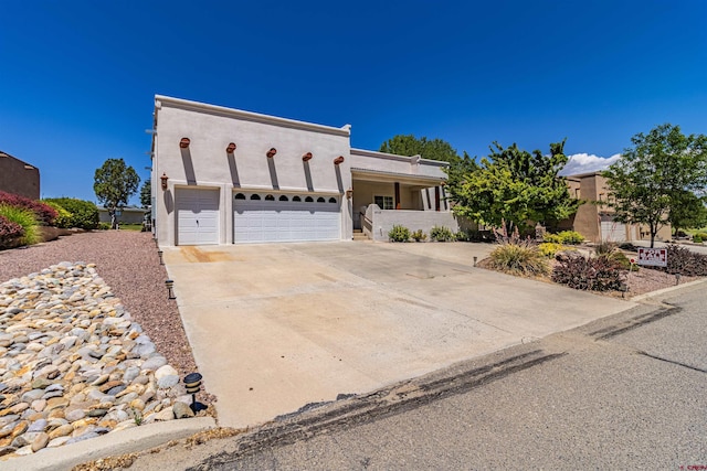 adobe home featuring a garage