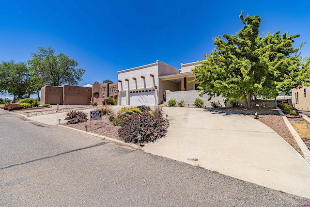 southwest-style home featuring a garage