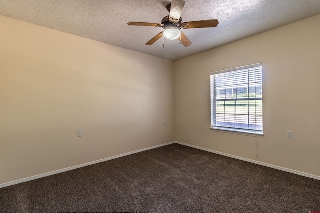 unfurnished room featuring dark colored carpet, ceiling fan, and a textured ceiling